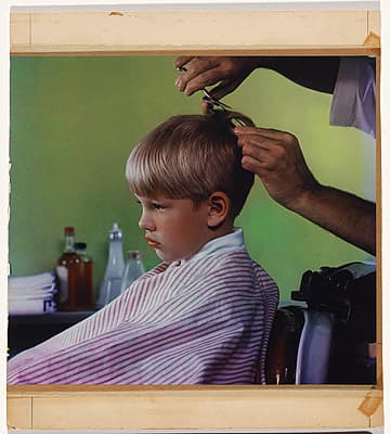 Anton BRUEHL | not titled [Boy getting his hair cut]