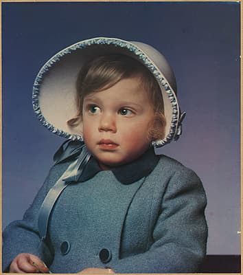 Anton BRUEHL | not titled [Little girl wearing bonnet and coat]