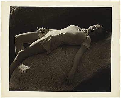 Anton BRUEHL | not titled [Young woman lying on a rock (possibly  Eleanor Holm) ]